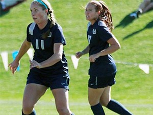 USU women's soccer players on the field in action