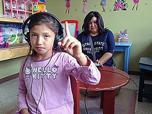 USU audiology student Victorial Reyes administering a hearing test in Costa Rica