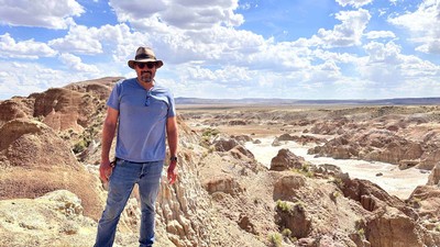 Benjamin Burger standing in a desert landscape.