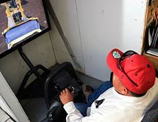 A USU Eastern Blanding student driving a bulldozer in the simulator