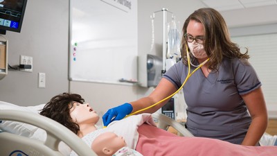 2021 USU Uintah Basin nursing graduate Makenzie Breitenbach uses the simulation lab.