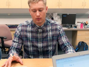 USU student researcher Zach Skabelund working in the Sensory Motor Behavior Lab