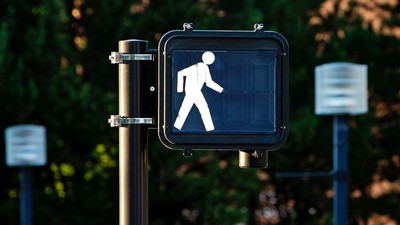 Pedestrian Walk signal at a crosswalk.