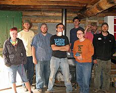 USU students inside cabin resporation project