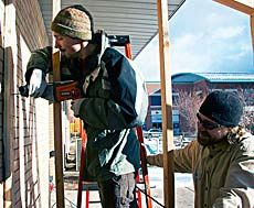 Etahan and Taylor DeVilbiss construction the greenhouse