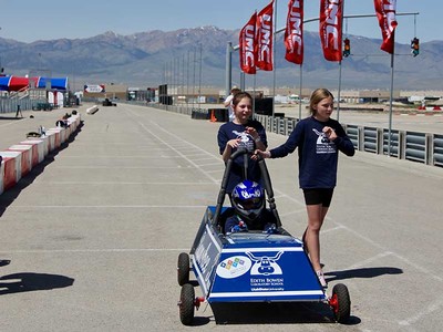 students from USU's Edith Bowen Lab School with their car