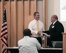 USU student Dan Kidd receiving an award