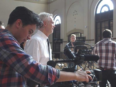JCOM broadcast student Eddie Collins makes camera adjustments