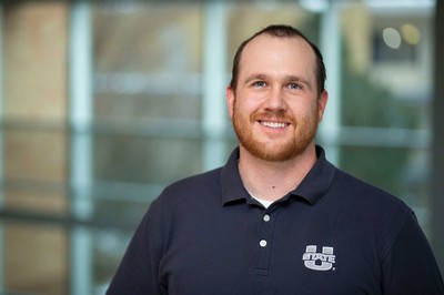 Jack Elliot poses for a photograph in a U State polo shirt.