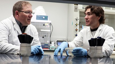 Jackson and Crosby at lab table talking