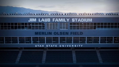 The facade of the USU football stadium, showing the new name.
