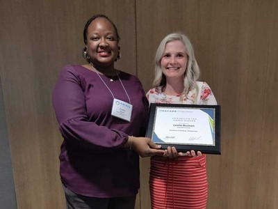 Leslie Buxton (right) with award presenter.