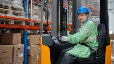 A person operating a forklift.