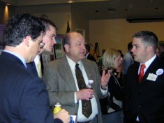 Senator Lyle Hillyard talks with student researchers