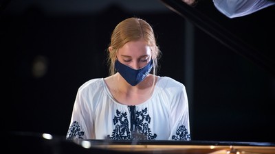 Emma Musselman, a graduate student in the piano performance program, performs on stage.