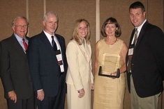 Utah State University personnel receive the award