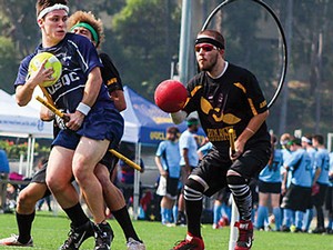 Members of the USU Quidditch team on the field