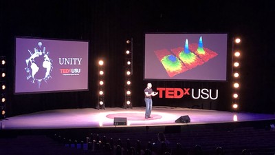 Speaker presenting at USU's TEDx Unity Conference.