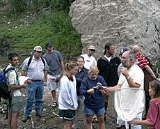 Watershed Sciences department head and students on field trip