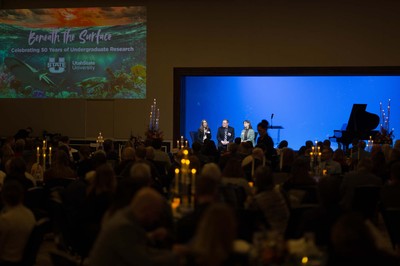 A panel presentation at an aquarium.