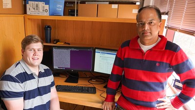 Kolton Hauck with mentor Rakesh Kaundal in USU Bioinformatics Facility.