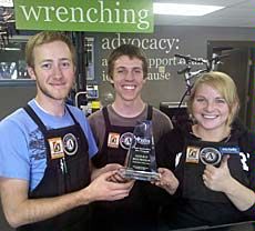Aggie Blue Bikes staff with award