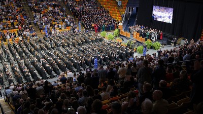 Bird's eye view of USU's Spectrum filled with students for commencement