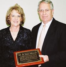 Joyce Albrecht and Stan Albrecht with award