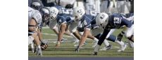Aggie football team on field