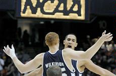 Aggie men's basketball players celebrating