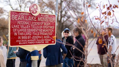 A close up of a marker near a lake