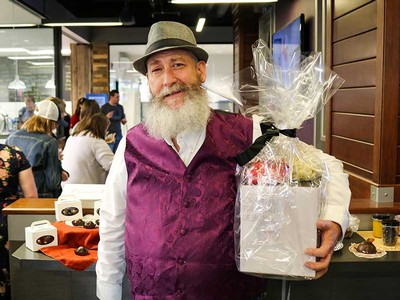 Ted Erickson holds his first-place winnings.