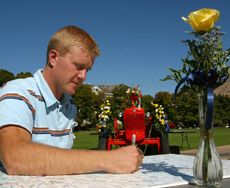 Cody Bingham signs a condolence poster 
