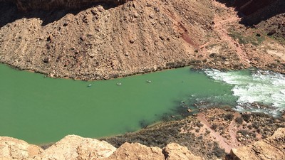 An aerial view of rafts on the Colorado River.