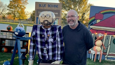Dan Davis and a mannequin with a pumpkin head painted to look like Dan Davis.