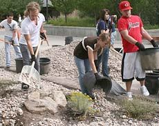 Connection participants installing rock cover