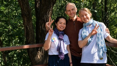 People posing for a photo outdoors.