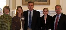 Charles Swenson poses with his family alongside President Albrecht 