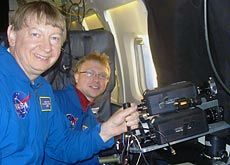 Taylor, left, and Snively aboard a NASA DC-8 observation plane