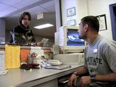 A student talks with an RA