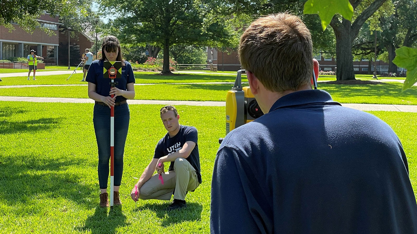 USU students operate surveying equipment.