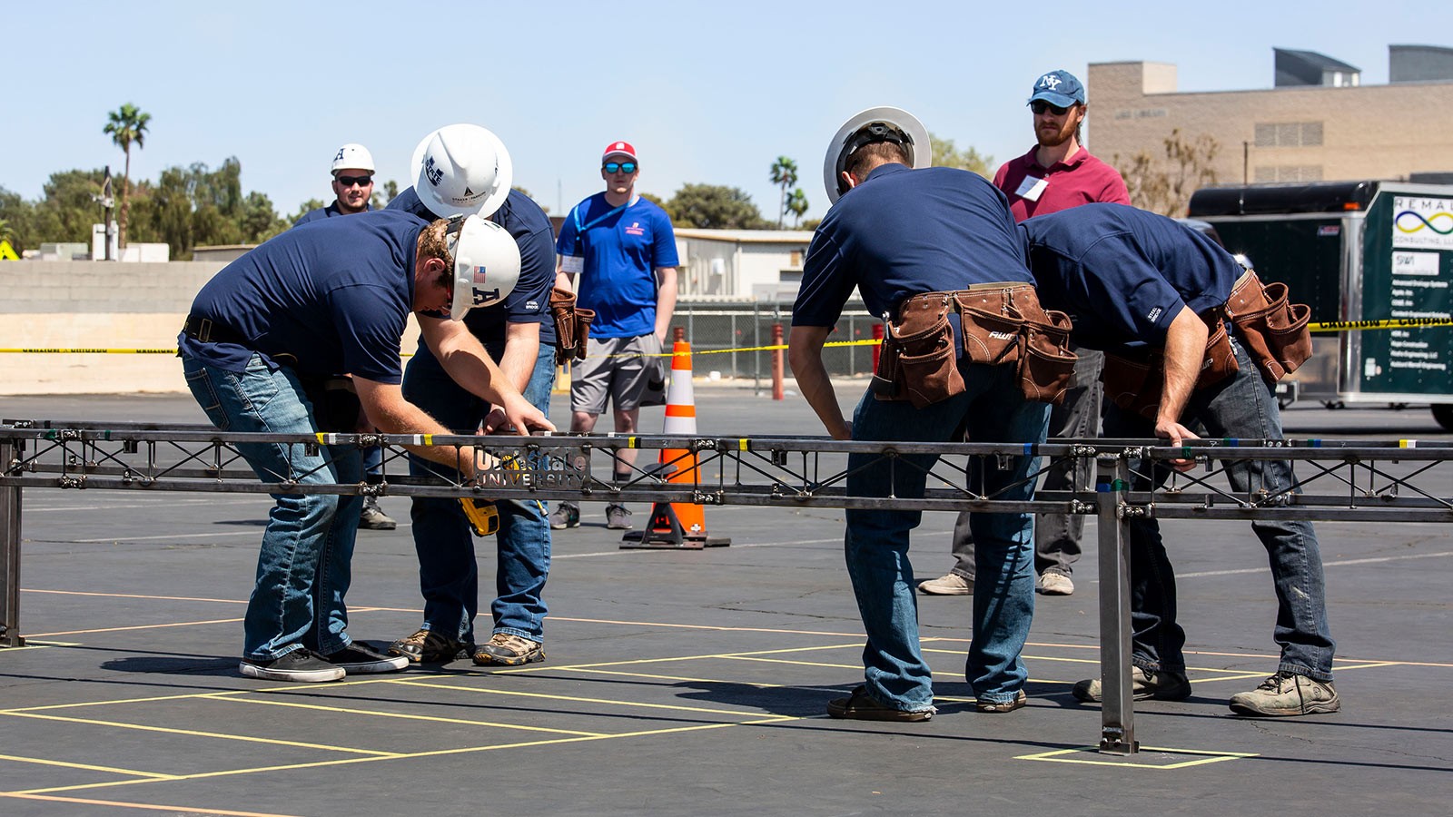 Engineering students build a model bridge.