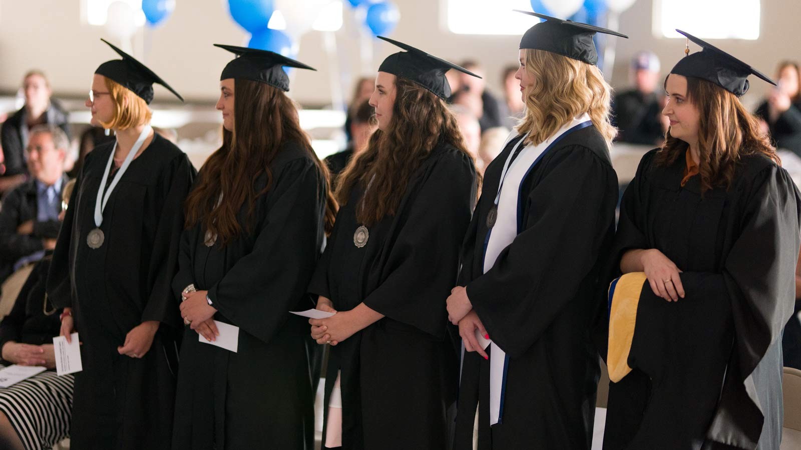 Graduates listen during the 2022 USU Southwest Commencement.