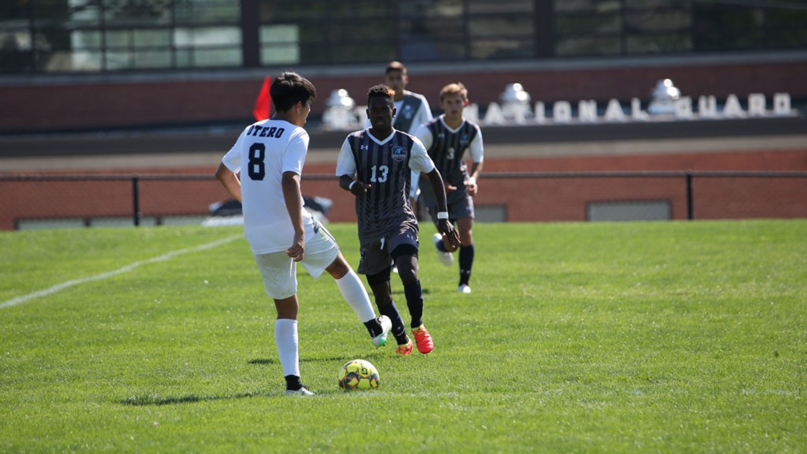 Men play soccer.
