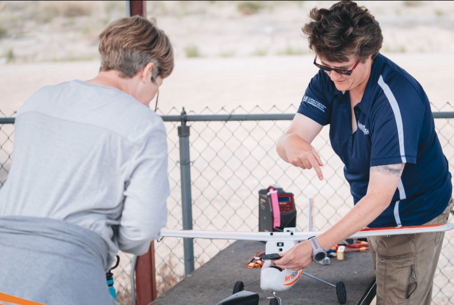 Shalyn Drake with a small drone aircraft.