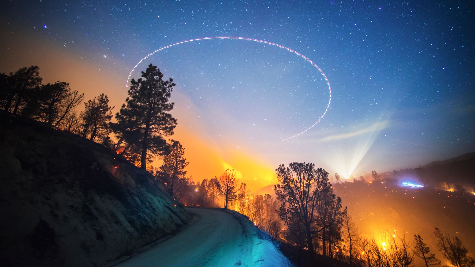 A wildfire burning at night.