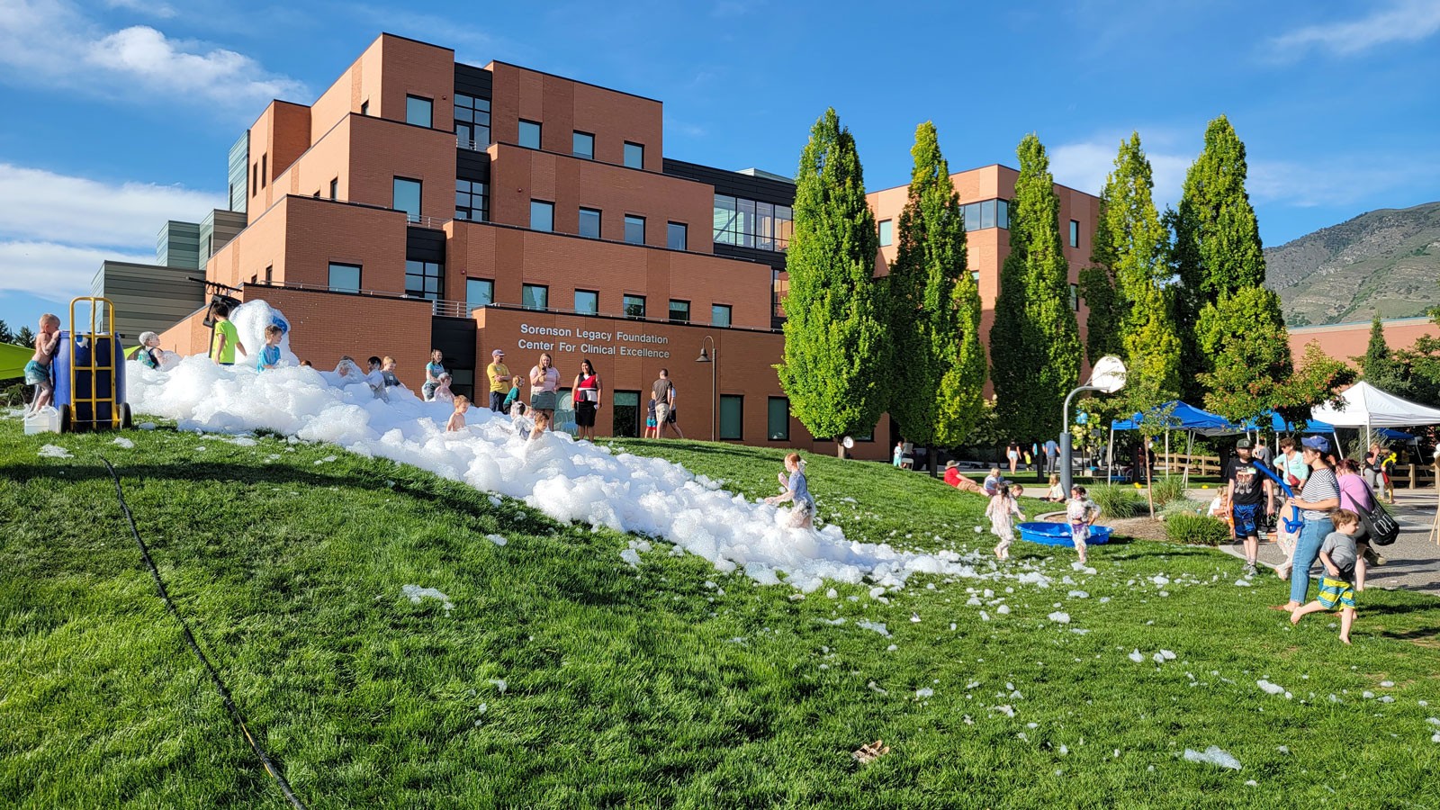 Children playing in a pile of bubble foam.