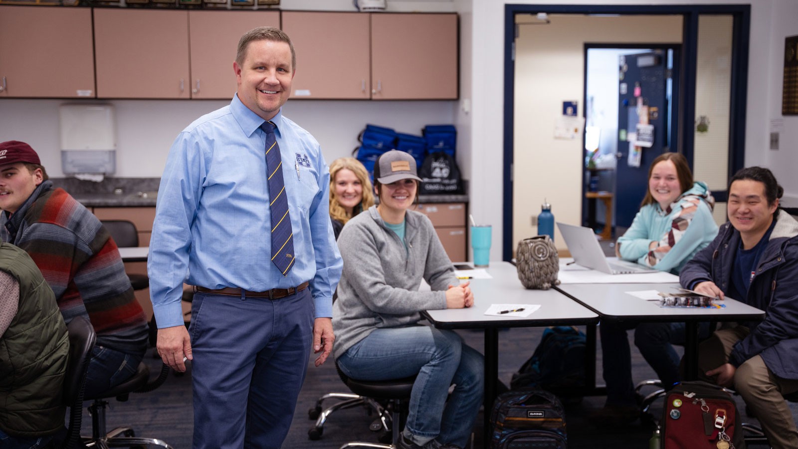 Tyson Sorensen and students in a classroom.