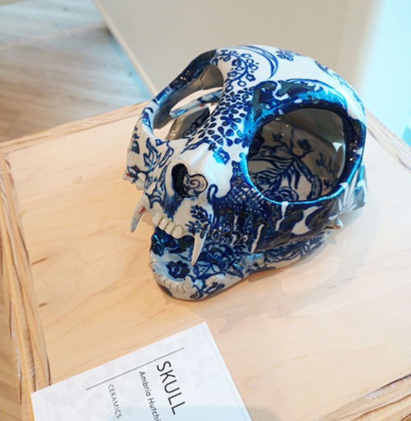 A white and blue ceramic animal skull.