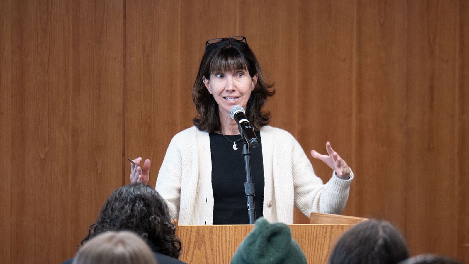 Jennifor Sinor speaking at a rostrum.